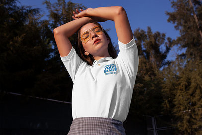 Polo Shirt Mockup of a Young Woman with Her Arms Over Her Head