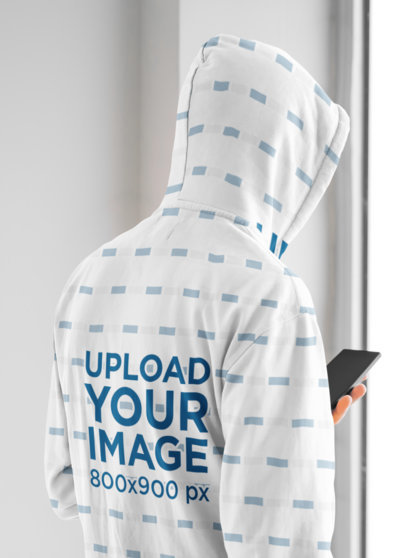 Back-View Mockup of a Man Wearing a Sublimated Hoodie