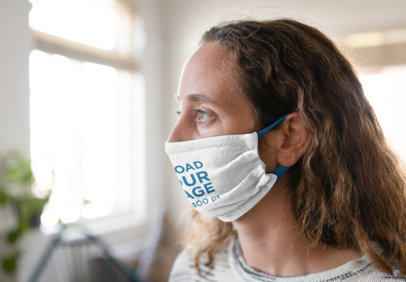 Face Mask Mockup Featuring a Woman at Home