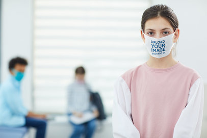 Face Mask Mockup Featuring a Serious Girl