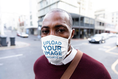 Face Mask Mockup of a Man Standing on a Street Corner
