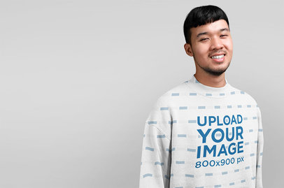 Studio Mockup of a Man Wearing a Sublimated Sweatshirt
