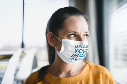 Face Mask Mockup Featuring a Serious Woman