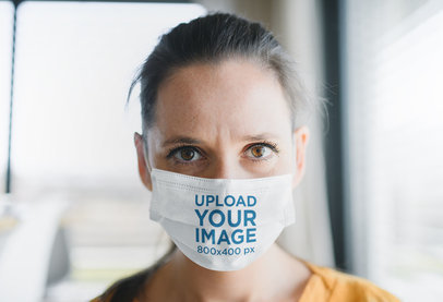 Face Mask Mockup of a Woman Staring into the Camera
