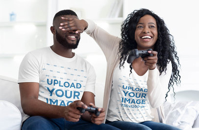 T-Shirt Mockup of a Woman Joking with Her Boyfriend while Playing Video Games 38820-r-el2