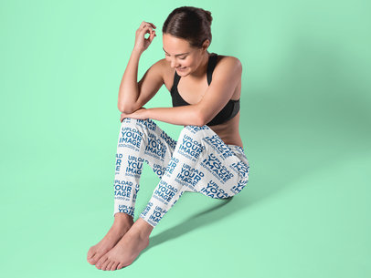 Sweatpants Mockup Featuring a Woman Sitting in a Studio