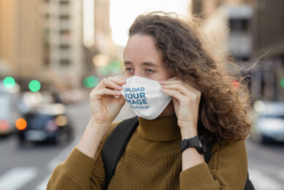 Face Mask Mockup Featuring a Woman on a Windy Street