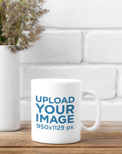 Mockup of an 11 oz Coffee Mug Placed on a Rustic Table Next to a Vase