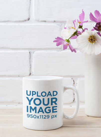11 oz Mug Mockup Featuring a Rustic Wooden Table and a Small Flower Vase