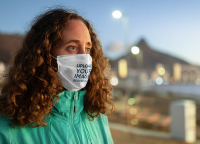 Face Mask Mockup of a Curly-Haired Woman in an Urban Setting