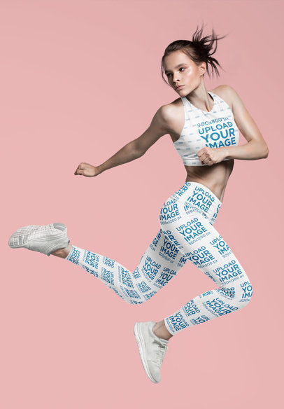 Sports Bra and Leggings Mockup of a Woman Jumping in a Studio 37595-r-el2
