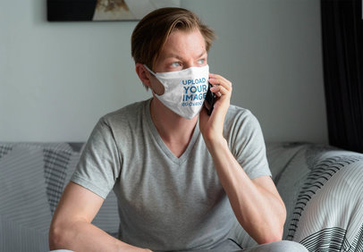 Mockup of a Man Wearing a Face Mask While Talking on the Phone at Home