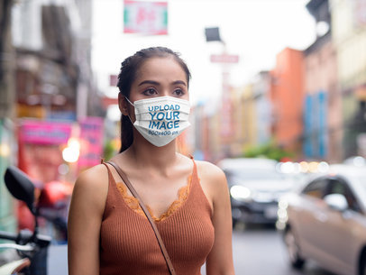 Mockup of a Woman Wearing a Face Mask in a Street 40289-r-el2