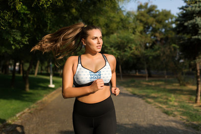 Mockup of a Long-Haired Woman Running with a Plus-Size Sports Bra
