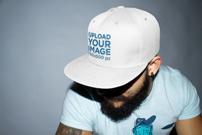 Mockup of a Bearded Man Wearing a Snapback Hat