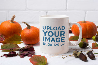 Mockup Featuring an 11 oz Mug Surrounded by Pumpkins