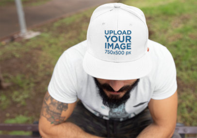 Mockup of a Bearded Man Wearing a Snapback Hat 