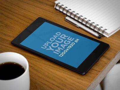 Mockup of a Nexus 7 in Portrait Position Placed over a Wooden Desk