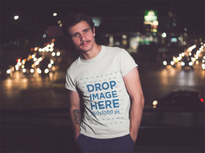 Young Hipster Guy With Moustache Wearing Round Neck Tee In The City At Night With Car Lights Behind Mockup