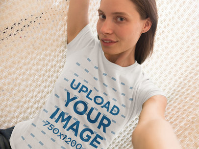 Cool Young White Woman Wearing Round Neck Tee While Lying On Hammock
