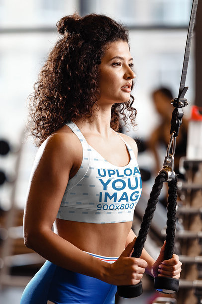 Sublimated Sports Bra Mockup of a Curly-Haired Woman Working Out at the Gym 