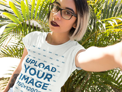 Trendy Girl Wearing A Tshirt With A Plant Nearby Mockup a13623