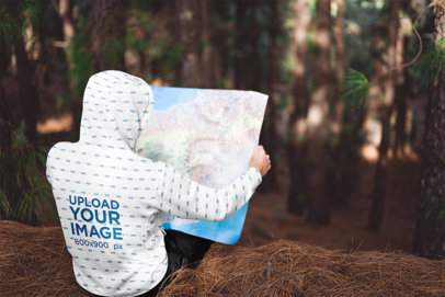 Back View Mockup of a Man with a Sublimated Hoodie Looking at a Map