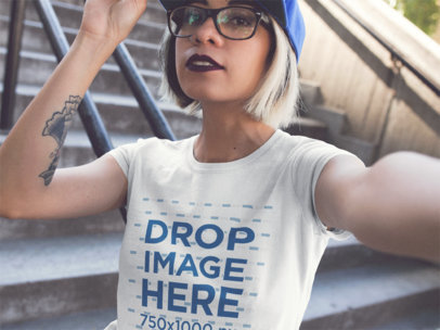 Selfie Of A Trendy Girl Wearing A Round Neck TShirt And A Blue Cap Mockup a13622