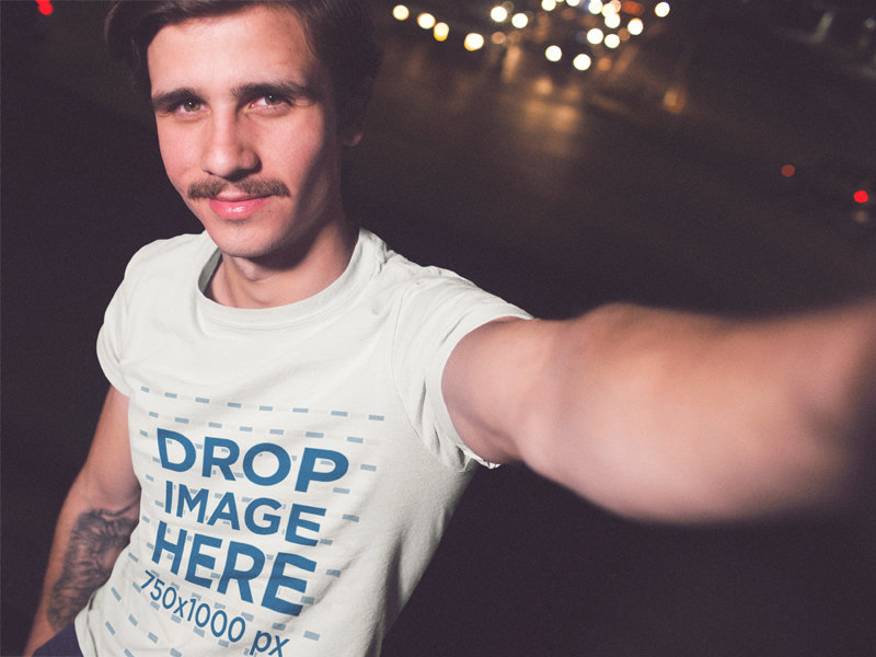 Selfie Of A Hipster Young Man Wearing A Round Neck Tee While In The City At Night