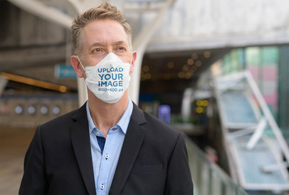 Mockup of a Man Wearing a Face Mask with a Formal Attire