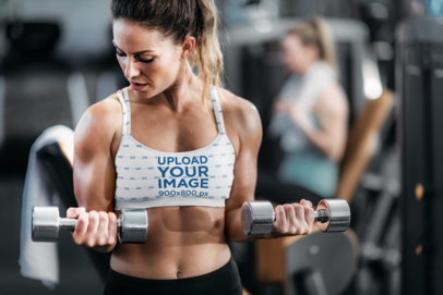 Sports Bra Mockup of a Woman Doing Bicep Curls