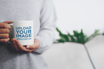 Mockup Featuring a Woman Holding an 11 oz Coffee Mug With Both Hands 