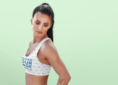 Studio Mockup of a Fit Woman Wearing a Sublimated Sports Bra