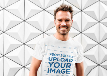 T-Shirt Mockup Featuring a Man Against a Patterned Background