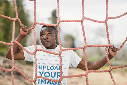 T-Shirt Mockup of a Man Climbing a Cargo Net