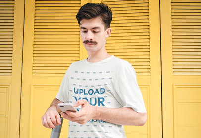 T-Shirt Mockup of a Man with a Mustache Checking His Phone 39880-r-el2