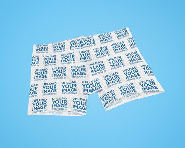 Mockup of Bike Shorts Lying on a Customizable Surface 41464-r-el2