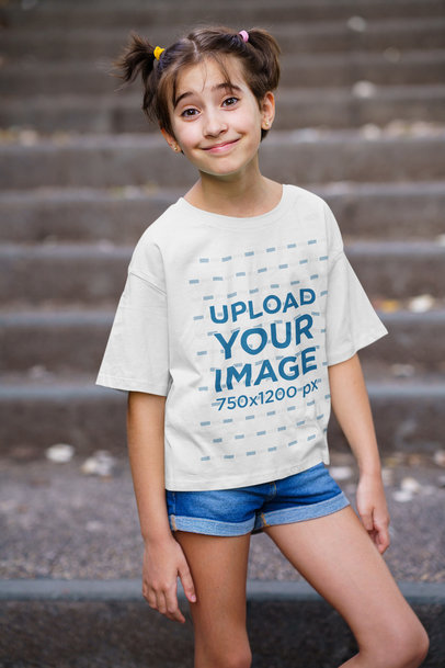 T-Shirt Mockup of a Girl Posing by a Concrete Staircase 