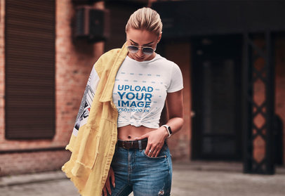 Mockup of a Stylish Woman Wearing a Knotted Tee 