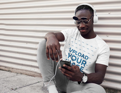 T-Shirt Mockup of a Man Listening Music on the Street 39921-r-el2