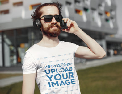 T-Shirt Mockup of a Bearded Man Listening to Music