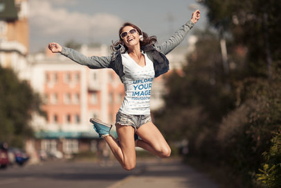 T-Shirt Mockup of a Happy Woman Jumping Around While Listening to Music 37593-r-el2