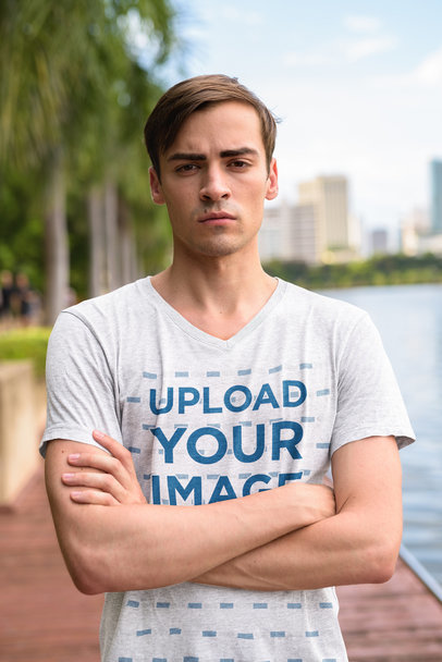 V-Neck T-Shirt Mockup of Man with a Serious Face and Crossed Arms