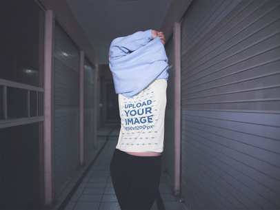 Mockup Of A Girl Wearing A T-Shirt While Taking Off Her Hoodie a13576