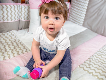 Beautiful Baby Girl Sitting Down Happy While Wearing A Onesie And Playing With Her Purple And Pink Toy Mockup