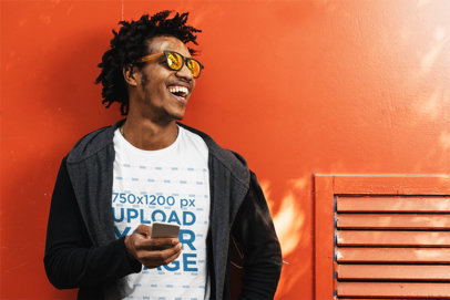 T-Shirt Mockup Featuring a Smiling Man Leaning Against a Wall
