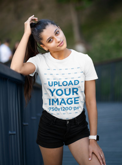 T-Shirt Mockup Featuring a Young Woman Grabbing Her Hair