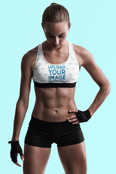 Sports Bra Mockup Featuring an Athletic Woman in a Studio