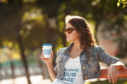 Mockup of a Trendy Woman Drinking from a Paper Cup While Wearing a V-Neck Tee 38055-r-el2