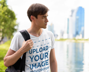 Mockup Featuring a Serious Man Wearing a Heathered V-Neck Tee